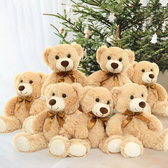 Gros ours en peluche beige assis