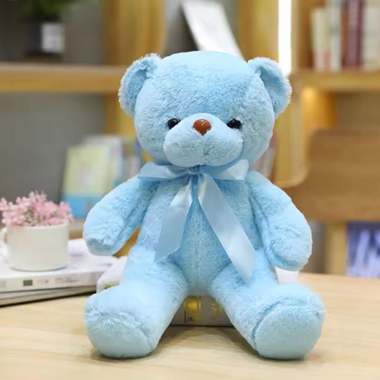 Ours en peluche bleu avec ruban
