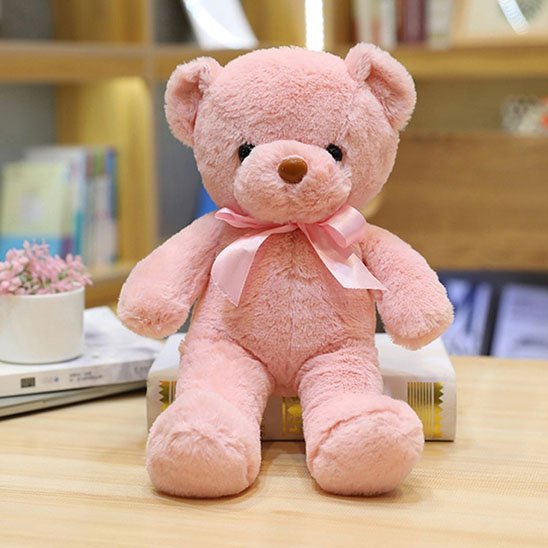 Ours en peluche rose avec nœud élégant