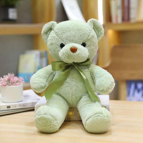Ours en peluche vert avec ruban décoratif